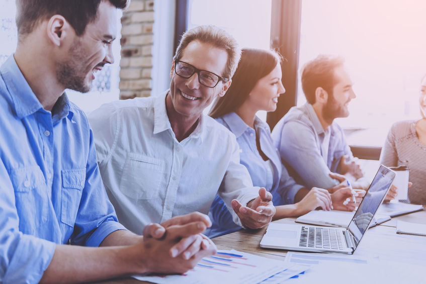business people in smart casual wear discussing affairs.